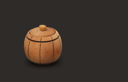 brown wooden mini keg with lid isolated on black background, close up. High quality photoの写真素材