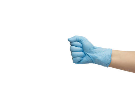 a hand in a blue nitrile glove is clenched into a fist. isolated on white background. High quality photo. High quality photoの写真素材