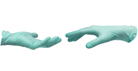 Two hands in sterile mint-colored nitrile gloves reach out to each other. Skin protection during epidemics and quarantine. There is a place for text. High quality photoの写真素材