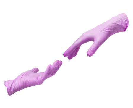 Two hands in sterile pink nitrile gloves reach out to each other. Skin protection during epidemics and quarantine. There is a place for textの写真素材