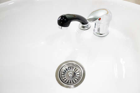 crystal clear hair wash in a beauty salon with black watering. selective focus.High quality photo