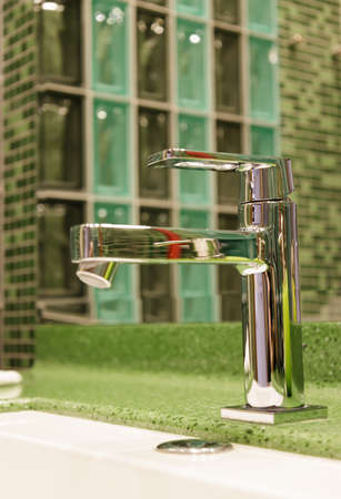 brilliant steel faucet for water interesting close-up design. selective focus.High quality photoの写真素材