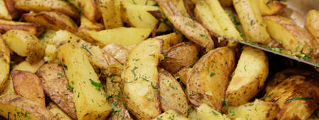 beautiful potatoes baked with wedges in the oven with fragrant herbs. selective focus .High quality photoの写真素材