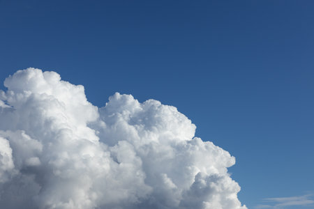 White fluffy clouds in a blue sky. High quality photoの写真素材