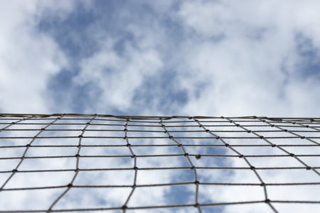 Volleyball net with blue sky for background design. High quality photoの写真素材