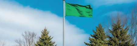 green flag or banner against a blue sky with clouds .mockup. place for your text or advertisement. Generative AIの素材