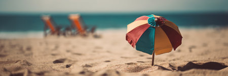 umbrella and deck chair on the sand on the beach on a sunny day .tiltshift. banner .concept travel tourism and vacation .Generative AIの素材