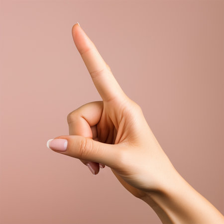 gesture of a womans hand on a colored background.の素材