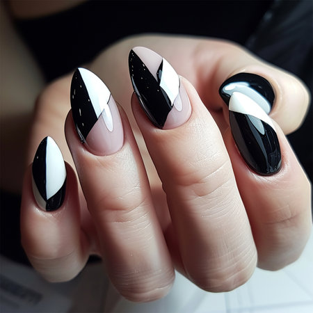 Beautiful manicure for long nails in black and white ,geometric nail design and extensions in a nail salonの素材