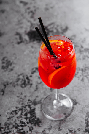 Glass of aperol spritz cocktail long drink close up.の写真素材