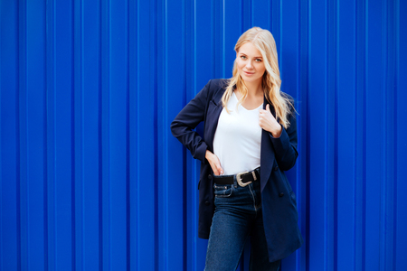 Young girl on blue backgroundの写真素材