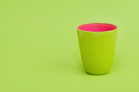 green cup on a green backgroundの写真素材