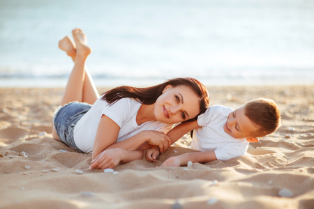 mother and son on the beachの写真素材