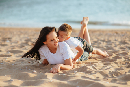 mother and son on the beachの写真素材