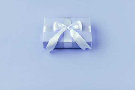 Gift or present box on blue
