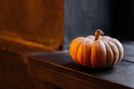 halloween pumpkin on wooden backgroundの写真素材