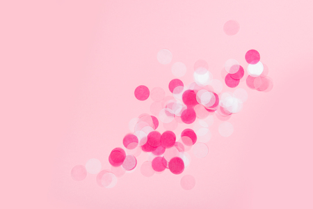 Colorful Confetti on pink Backgroundの写真素材