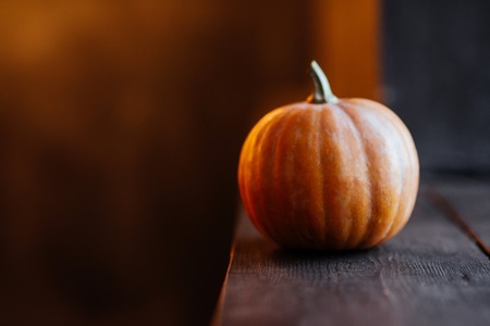 halloween pumpkin on wooden backgroundの写真素材