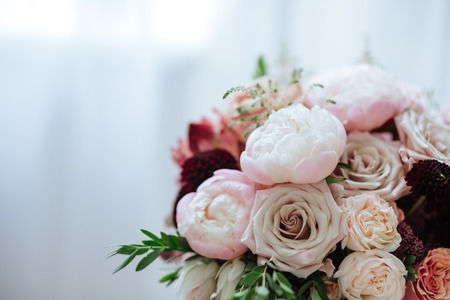 Spring bouquet of mixed flowers on vintage gray wall background behindの写真素材