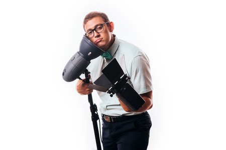 photographer in his studio setting up lights for the upcoming photoshoot