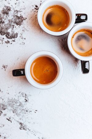 Three cups of freshly brewed espresso coffeeの写真素材