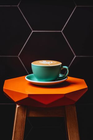 Cappuccino. Cup of Cappuccino Coffee on orange tableの写真素材