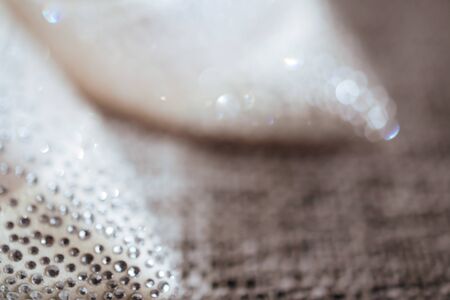 silver and white bokeh lights defocused.の写真素材