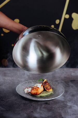 Baked salmon garnished with asparagus and tomatoesの写真素材