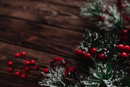 blurred Fir tree branches with Christmas decoration on blue wooden background, flat lay. Space for textの写真素材