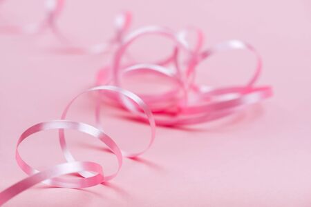 beautiful pink ribbon on bright backgroundの写真素材