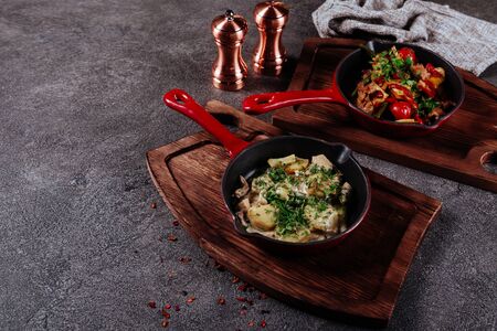 Cooking Stew meat in Burgundy in cast iron frying panの写真素材