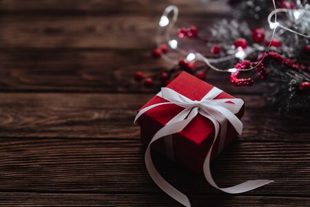 Christmas presents on dark wooden background in vintage styleの写真素材