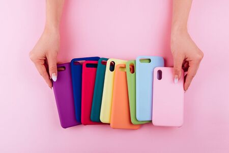 Up to date technology.Top view of diverse personal accessory laying on the pink backgroundの写真素材