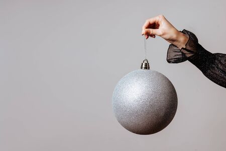 White christmas ball in female hand