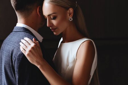 Happy bride and groom near old castleの写真素材