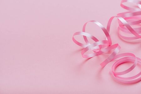 beautiful pink ribbon on bright backgroundの写真素材