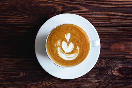 two cups of coffee on vintage wood. Top view , cup on wooden table. View from topの写真素材