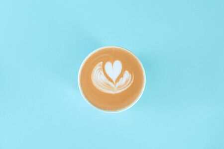 Blue cup of latte art with copy space.