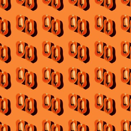 Papaya creative tropical pattern vivid orange background.