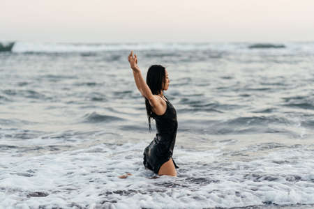 Smile Freedom and happiness chinese woman on beach.の写真素材
