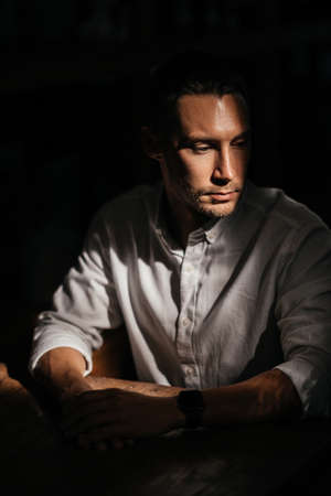 portrait of handsome man sitting in cafe