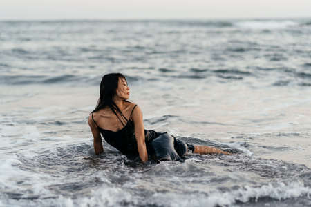 Smile Freedom and happiness chinese woman on beach.の写真素材