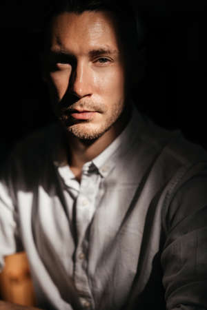 portrait of handsome man sitting in cafeの写真素材