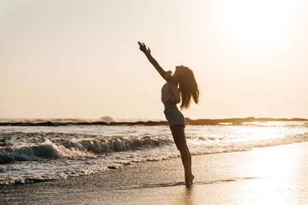 Smile Freedom and happiness chinese woman on beach.の写真素材