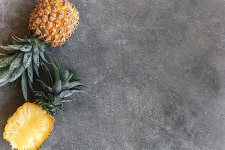 Pineapple on a stone table. Tropical Fruits.の写真素材