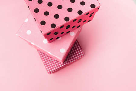 Gift boxs on paste pink background.