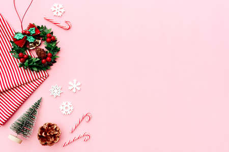 Christmas composition. Christmas gifts, pine branches, toys on pink background.の写真素材