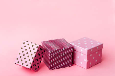 Gift boxs on paste pink background.
