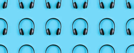 Wireless headphones on colorful background.