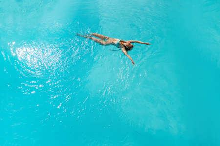 Beautiful women relaxing at the luxury poolside.の写真素材